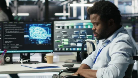 Engineer with paraplegia in data center annoyed by slow AI node tree software Video stock 308042003