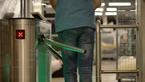 Engineer is passing through a modern turnstile in automotive factory 動画素材 124605062
