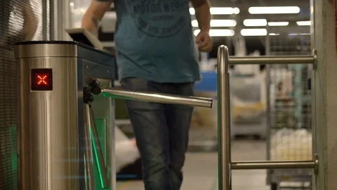 Engineer passing through a modern turnstile in an industrial automotive factory 動画素材 124606719