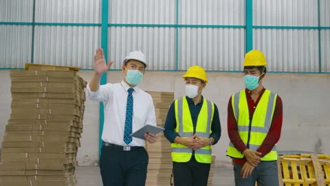 Engineer people are wearing  protective mask working in warehouse Stock Footage 158174021