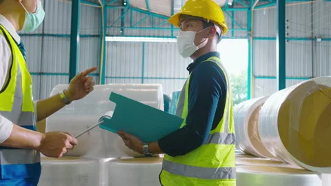 Engineer people are wearing  protective mask working in warehouse 動画素材 158174480