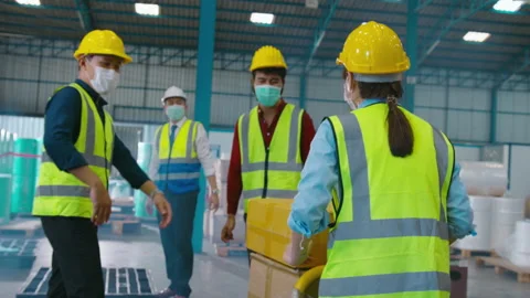 Engineer people are wearing  protective mask working in warehouse 動画素材 158174787