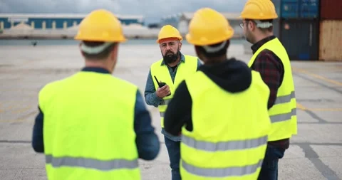 Engineer people controlling shipping containers inside industrial port Stock Footage 179968095