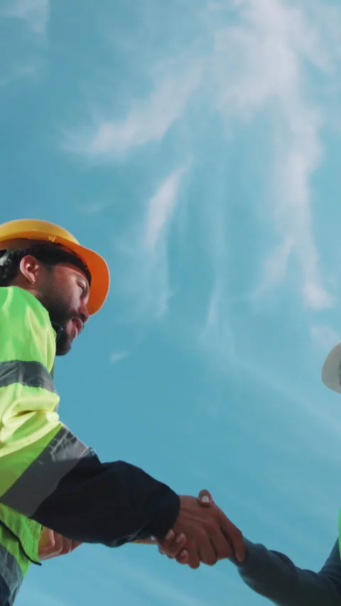 Engineer, people or handshake with team at construction site, meeting or Stock Footage 346955690