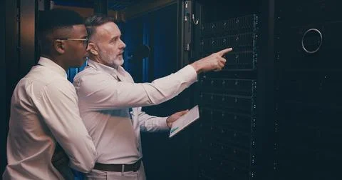 Engineer, people or tablet with inspection in server room for maintenance Stock Photos