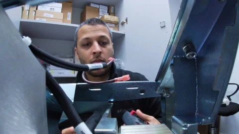 Engineer performing repair of electronic equipment Stock Footage 134852915