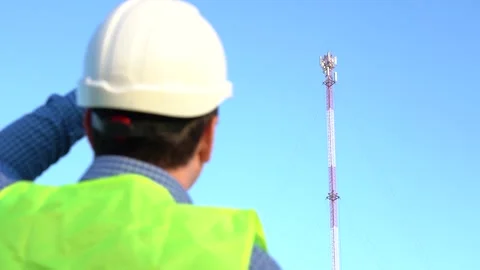 An engineer photographs a telecom tower for a report. Stock Footage 166052914