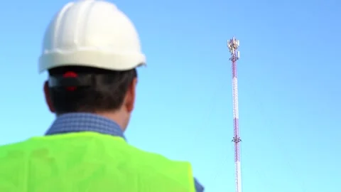 An engineer photographs a telecom tower for a report. Stock Footage 167213878