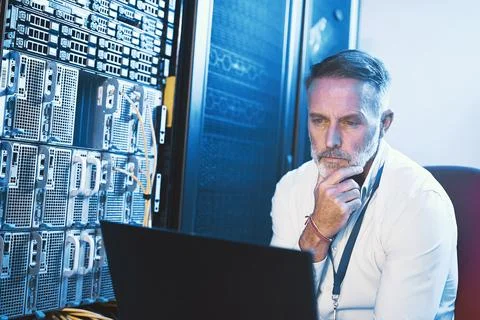 Engineer, plan and man with laptop in server room, reflection and Stock Photos