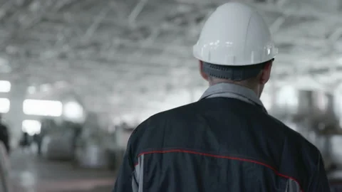 Engineer Plan of Designing Work for Metalwork. Caucasian People in Safety Hard H Stock-Footage 199475750