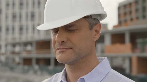 Engineer Plan of Manufacture Work. Caucasian People in Safety Hard Hat or Stock Footage 111764656