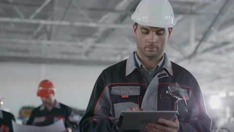 Engineer Plan of Manufacture Work. Caucasian People in Hard Hat or Safety Clothe Video stock 199475812