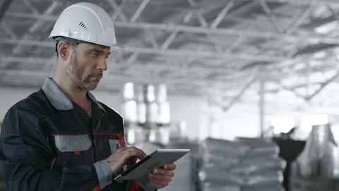 Engineer Plan of Manufacture Work. Caucasian People in Hard Hat or Safety Clothe Видео 199475925