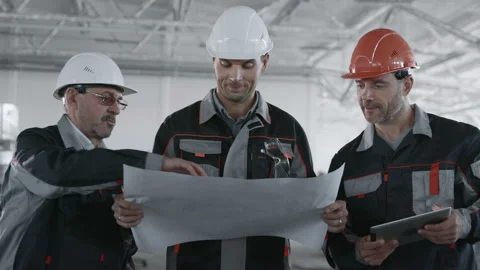 Engineer Plan of Manufacture Work. Caucasian People in Hard Hat or Safety Wear. Video stock 199475926