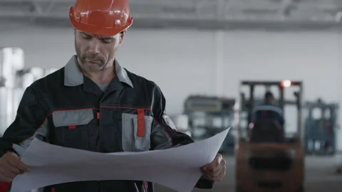 Engineer Plan of Manufacture Work. Caucasian Male People in Hard Hat or Safety W Stock Footage 199475979