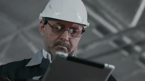 Engineer Plan of Manufacture Work. Caucasian Male People in Hard Hat or Safety W Stock Footage 199475988