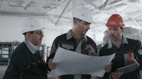 Engineer Plan of Manufacture Work. Caucasian Labor People in Safety Hard Hat or Stock Footage 199476129