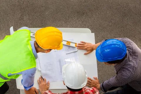 Engineer planning project team partners meeting at building construction site Фото