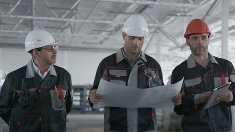 Engineer Planning Work at Machine Manufacture. Male Person in Hardhat or Protect Stock Footage 199476132