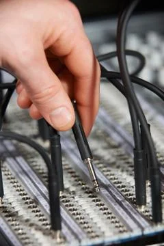 Engineer Plugging Cable Into Patch Panel Stock Photos