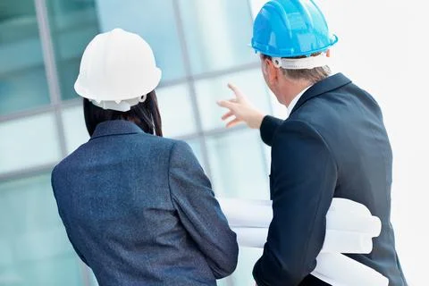 Engineer, pointing and back of business people with blueprint for architecture,  Stock Photos