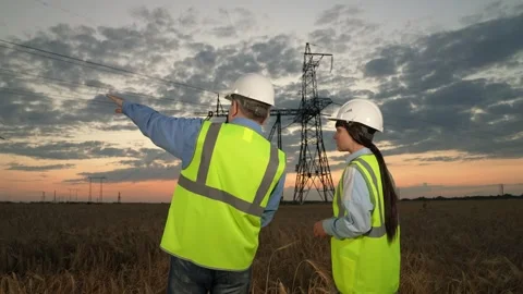 Engineer points by hand on power transmi... | Stock Video | Pond5
