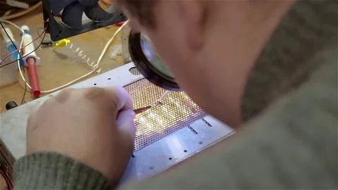 Engineer preparing new chip processor for installation on motherboard of Stock Footage 71026300