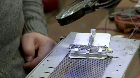 Engineer preparing new chip processor for installation on motherboard of Stock Footage 71026907