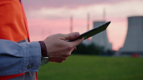 The engineer prints a report on the inspection of power grids on a tablet Stock Footage 234264739
