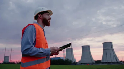 An engineer prints a report on the operation of the power plant on a tablet Stock Footage 201483447