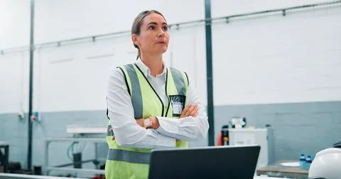 Engineer, problem solving and woman in factory for robotics, manufacturing and Foto stock