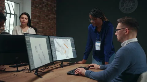 Engineer programmer creating 3D visualization of working drawing of new engine Stock Footage 231349630