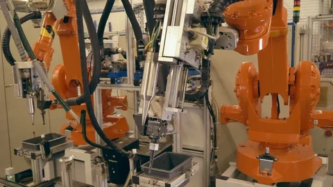 Engineer programming automatic industrial robot / robotic arm in automotive 動画素材 124611515