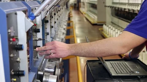 Engineer Programming The Machine On The Production Line With Laptop Computer Stock Footage 201485497