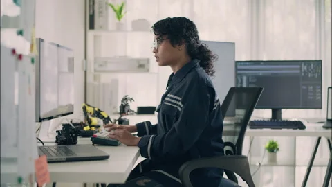 Engineer programming robotics and artificial intelligence with computer. Stock Footage 319001457