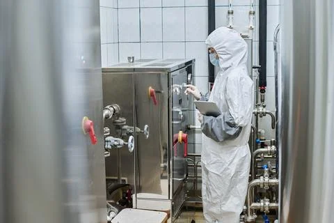 Engineer pushing button on machinery to start the work Stock Photos