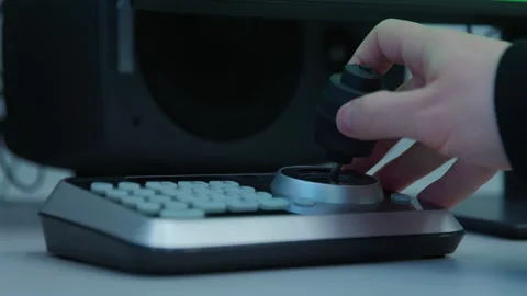 An engineer pushing buttons, moving a control knob on a digital device Stock Footage 273123045