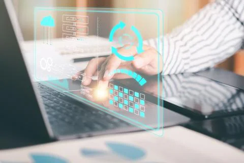 Engineer pushing software update button through laptop,, technology informa.. Stock Photos