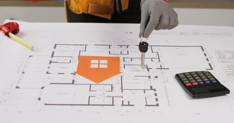 Engineer puts keys near paper house on architectural drawing 動画素材 277618050