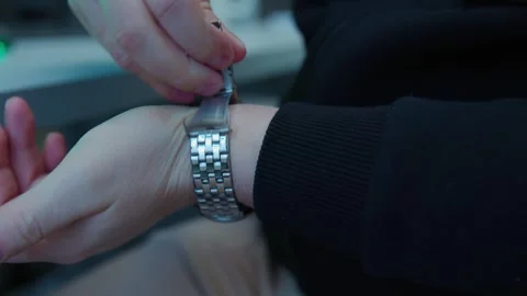 An engineer puts a mechanical watch on his hand, close-up shot Video stock 276925062