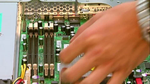 Engineer puts the memory into a computer. Computer hardware Stock Footage 75461879
