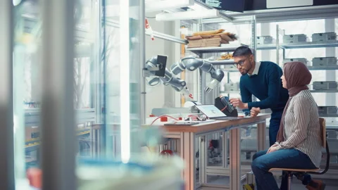 Engineer Raise Robot Arm With Controller Video stock 187584052