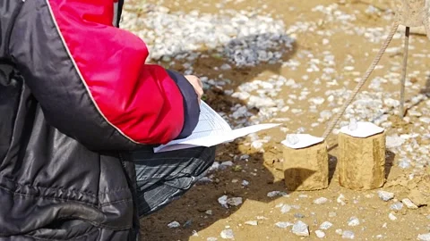 Engineer recording data from extracted soil samples on construction site Stock Footage 312671876