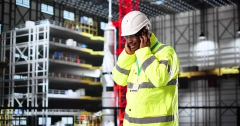 Engineer Regretting Decision To Skip Ear Protection At Car Factory. Digital T Stock Photos