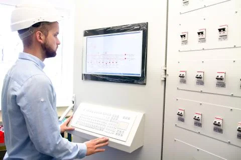 Engineer on remote controls electric power station Stock Photos