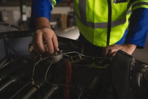 Engineer repairing aircraft engine 스톡 사진