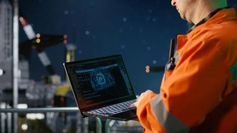 Engineer reviews artificial intelligence systems for oil platform operations Stock Photos
