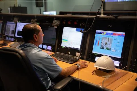 An engineer reviews test data inside a control room at the Launch Equipment.. Stock Photos