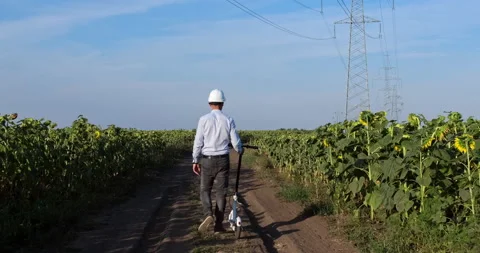 An engineer rides an electric scooter on the road Stockbeeldmateriaal 141249948