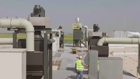 Engineer in safety equipment checking industrial ventilation and filtration.. Stock Footage 337605040
